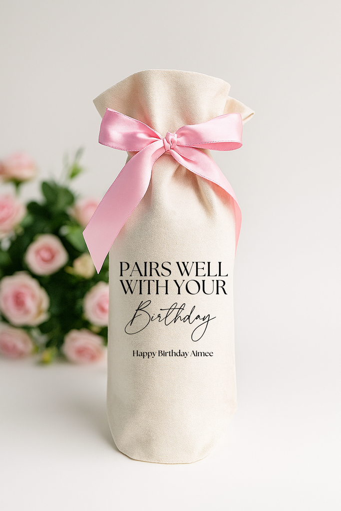 Personalized wine gift bag in cotton canvas fabric with a pink satin ribbon "Pairs Well With Your Birthday" 